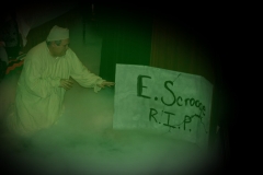 Scrooge sees the tombstone
